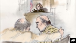 This courtroom sketch shows Nakoula Basseley Nakoula talking with his attorney Steven Seiden, left, as U.S. Central District Chief Magistrate Judge Suzanne Segal presides over the proceeding in Los Angeles, California, September 27, 2012. 
