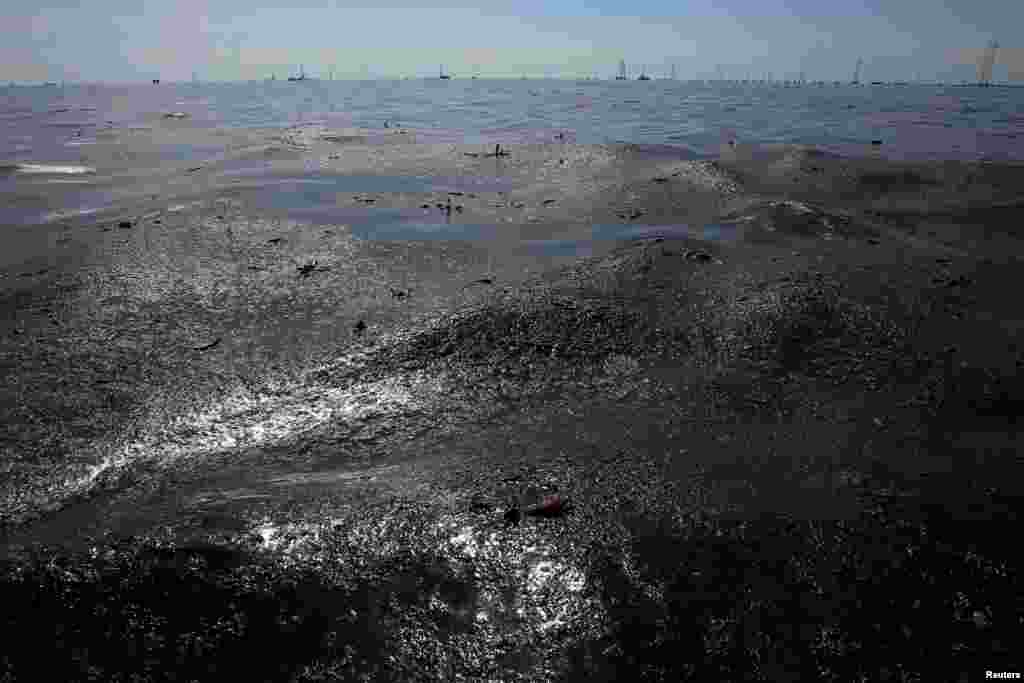 Oil floats on the surface on the Lake Maracaibo in Lagunillas, Venezuela. Picture taken May 24, 2018. 