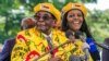 FILE: Zimbabwe's late former President Robert Mugabe and First Lady Grace Mugabe