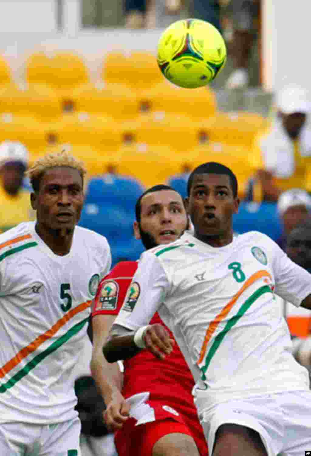 Niger's Olivier tussles for a loose ball with Tunisia's Yasine during their African Cup of Nations soccer match in Libreville