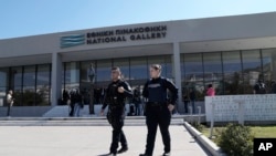 Greek police officers walk outside the National Gallery, as Nikolaos Papadopoulos, member of parliament of the small right-wing Niki party, has detained after he allegedly attacked art works being hosted at an exhibition, in Athens, March 10, 2025.