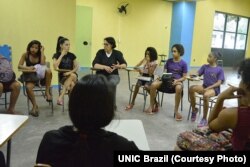 Young girls participate in a "One Win Leads to Another" workshop about leadership and self-esteem, sexual and reproductive health and rights, ending violence against women and girls and financial planning, at Olympic Vila of Mangueira, north of Rio de Janeiro.