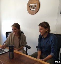 Chase Adam and Grace Garey review patient data at Watsi's office in San Francisco. (Photo: J. Sluizer)