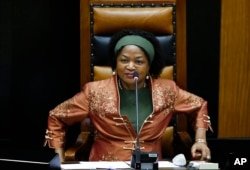 FILE - Speaker of the South African Parliament Baleka Mbete smiles during an answering of questions session by South African president Jacob Zuma, in Parliament, Cape Town, South Africa, March 11, 2015.