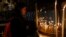 Christian worshiper lights candles at the Church of the Nativity, built atop the site where Christians believe Jesus Christ was born, on Christmas Eve, in the West Bank City of Bethlehem, Dec. 24, 2017. 