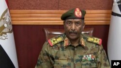 The head of Sudan's military, Gen. Abdel Fattah Burhan, announces in a televised address, that he is dissolving the country's ruling Sovereign Council, as well as the government led by Prime Minister Abdalla Hamdok, in Khartoum, Sudan, Oct. 25, 2021.