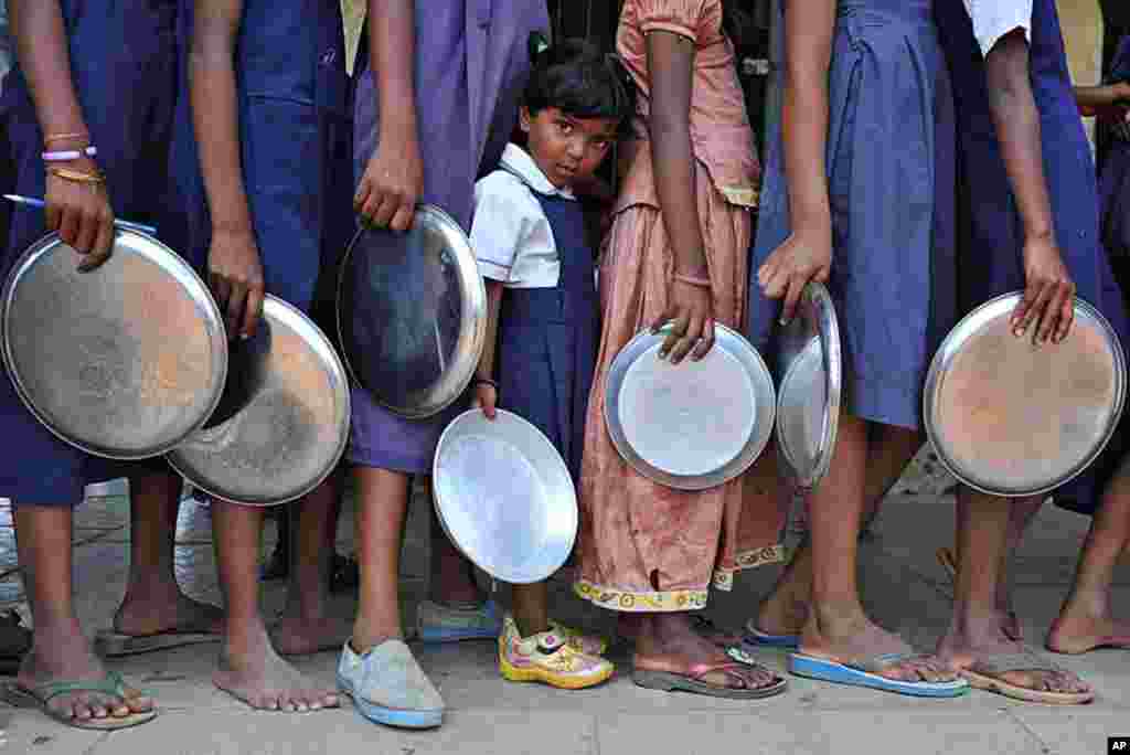 Indian schoolchildren waiting in line for their mid-day meal at a government primary school in the outskirts of Hyderabad, (File). (AFP)