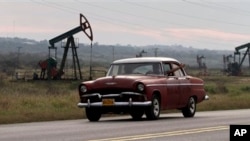 FILE - An old, U.S.- made car in Havana.