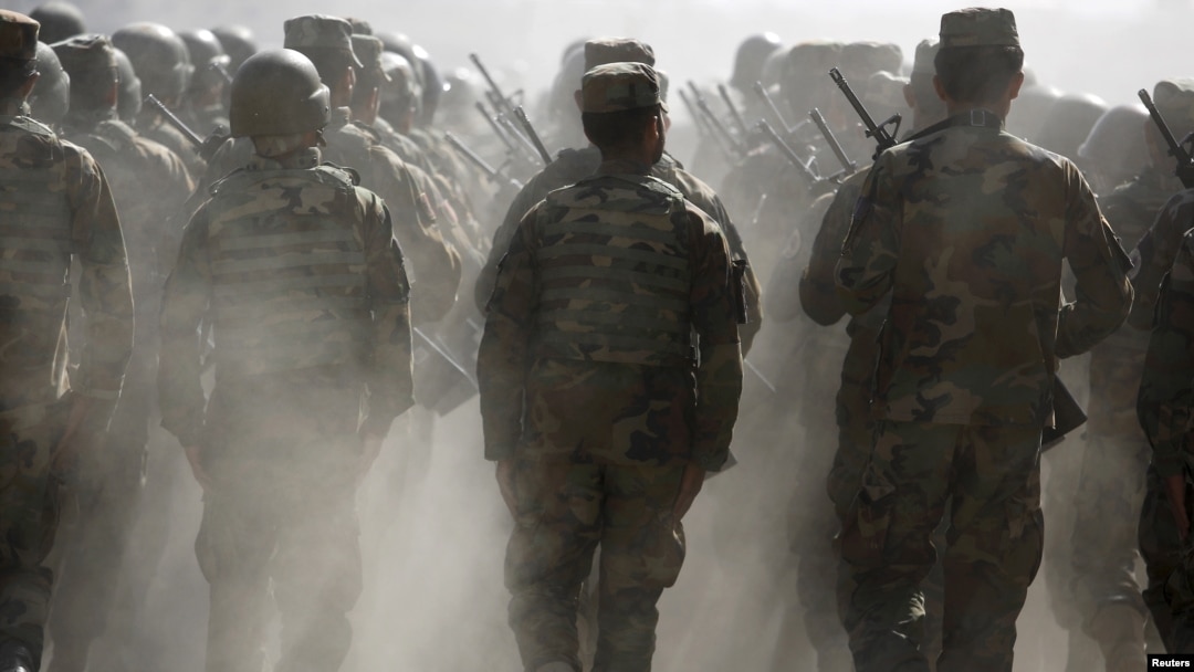 FILE - Afghan National Army (ANA) officers march during a training exercise at the Kabul Military Training Centre in Afghanistan, Oct. 7, 2015.