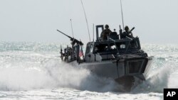 FILE - This Nov. 2, 2015, image provided by the U.S. Navy, shows Riverine Command Boat (RCB) 805 in the Persian Gulf. Iran is holding 10 U.S. Navy sailors and their two boats, similar to the one in this picture.