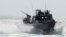 FILE - This Nov. 2, 2015, image provided by the U.S. Navy, shows Riverine Command Boat (RCB) 805 in the Persian Gulf. Iran is holding 10 U.S. Navy sailors and their two boats, similar to the one in this picture.