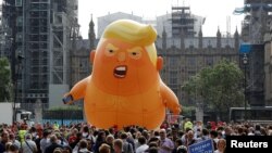 Demonstrators fly a blimp portraying U.S. President Donald Trump, in Parliament Square, during the visit by Trump and first lady Melania Trump in London, July 13, 2018.