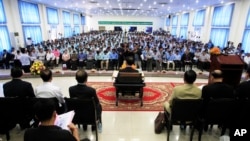 Teachers and students participate in a campaign by the National Election Committee, NEC, in Phnom Penh, Cambodia, Wednesday, May 9, 2018. NEC on Wednesday held its campaign with the teachers and students on the disseminate awareness of the law on the organization and functioning of the election law for the 2018 general election. (AP Photo/Heng Sinith)