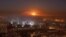 FILE - Smoke and flames rise after air strikes on rebel-controlled besieged area of Aleppo, as seen from a government-held side, in Syria, Dec. 11,  2016.