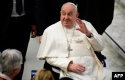 FILE - Pope Francis greets people at the end of an audience to the participants of the Pilgrimage Episcopal Conference of Scandinavia, on Feb. 3, 2025, at Paul-VI hall in the Vatican.