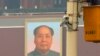 A man works on a security camera that was installed at Tiananmen Square in Beijing, November 1, 2013. China's domestic security chief believes a fatal vehicle crash in Beijing's Tiananmen Square in which five died was planned by a Uighur separatist group,