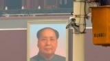 A man works on a security camera that was installed at Tiananmen Square in Beijing, November 1, 2013. China's domestic security chief believes a fatal vehicle crash in Beijing's Tiananmen Square in which five died was planned by a Uighur separatist group,