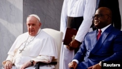 Pope Francis sits next to Democratic Republic of Congo's President Felix Tshisekedi as he attends the welcoming ceremony at the Palais de la Nation on the first day of his apostolic journey, in Kinshasa, Democratic Republic of Congo, January 31, 2023.