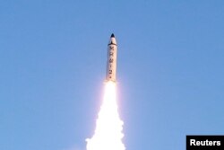 FILE - A view of the test-fire of a Pukguksong-2 missile, Feb. 13, 2017.