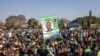 Supporters of the leader of the ruling Zambia Patriotic Front, incumbent president and candidate Edgar Lungu gather in Lusaka, on Aug. 11, 2021 for a virtual closing rally ahead of the general election.