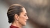 Mexico's President Claudia Sheinbaum attend a military parade commemorating the 114th anniversary of the Mexican Revolution at the Zocalo square in Mexico City, on November 20, 2024. (Photo by Rodrigo Oropeza / AFP)