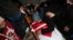 Hanan Issa Khdour, mother of Mohammad Khdour, 17, cries over the body of her son at the family house during his funeral in the West Bank village of Biddu, on Feb. 12, 2024. Khdour, a U.S. citizen, was shot Saturday by what his family alleges was Israeli fire.