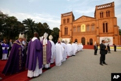 Pope Francis arrives to open the holy door of the Bangui cathedral, Central African Republic, Sunday, Nov. 29, 2015.