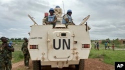 FILE - Peacekeepers from the United Nations Mission in South Sudan (UNMISS) provide security in Bentiu, South Sudan, June 18, 2017.