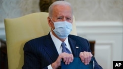 FILE - President Joe Biden is seen in the Oval Office of the White House in Washington, Feb. 3, 2021.