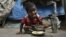 An Indian child eats midday meal organized by Andhra Pradesh government at a shanty area in Hyderabad, India, Jan. 11, 2012. 