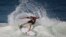FILE - Hawaiian surfer Mick Fanning competes in the 2015 Oi Rio Pro World Surf League competition at Barra da Tijuca beach in Rio de Janeiro, Brazil, May 12, 2015.