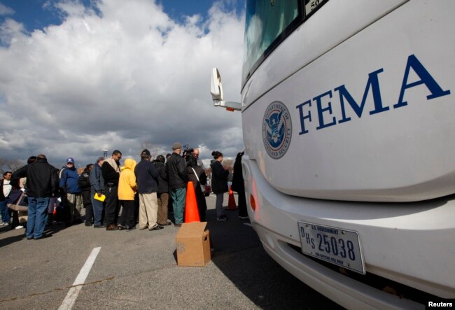 People wait in line to meet with FEMA officials in Coney Island, New York, Nov. 2, 2012, Four days after Sandy smashed into the Northeast.