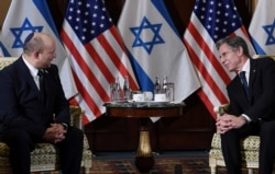 U.S. Secretary of State Antony Blinken meets with Israeli Prime Minister Naftali Bennett at the Willard Hotel in Washington, Aug. 25, 2021.