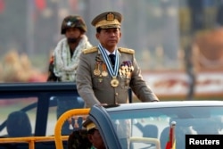 FILE - Myanmar's General Min Aung Hlaing takes part during a parade to mark the 72nd Armed Forces Day in the capital Naypyitaw, Myanmar, March 27, 2017.