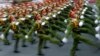 Military personnel take part in a parade celebrating the 40th anniversary of the end of the Vietnam War which is also remembered as the "Fall of Saigon," in Ho Chi Minh City, Vietnam, April 30, 2015. 