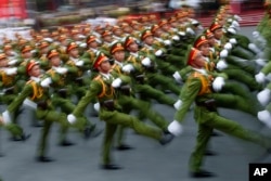 Military personnel take part in a parade celebrating the 40th anniversary of the end of the Vietnam War which is also remembered as the "Fall of Saigon," in Ho Chi Minh City, Vietnam, April 30, 2015.