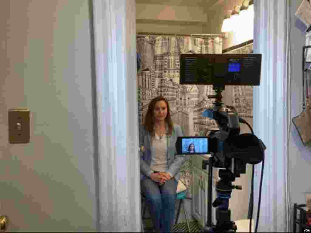 Broadcasting live to affiliates in Latin America, Celia Mendoza, a VOA Spanish service broadcaster, produces live remotes from her bathroom, turning the space into a television studio with a Washington, D.C.-themed shower curtain as a backdrop