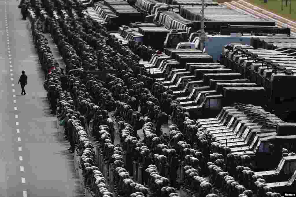 Members of the Brazilian Army, Navy and Air Force attend a presentation of Defense and Security personnel and equipment that will be used during the 2014 World Cup in Brasilia, June 8, 2014.