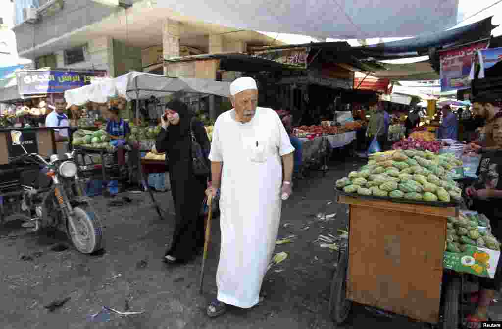 A Palestinian man walks through a market in Gaza City, July 17, 2014.