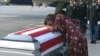 FILE - In this frame from video, Myeshia Johnson cries over the casket in Miami, Florida, Oct. 17, 2017, of her husband, Sgt. La David Johnson, who was killed in an ambush in Niger. 