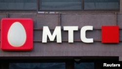 A logo of MTS mobile phone operator is seen on a building in central Moscow, Russia, March 10, 2016. 
