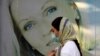 A woman wearing protective face mask to help prevent the spread of the coronavirus walks past an advertisement of skin care products in southern Tehran, Iran, Tuesday, July 20, 2021. Iran on Tuesday broke another record in the country's daily new…