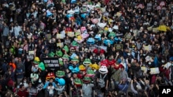 Pro-democracy protesters take part in a march in Hong Kong, Sunday, Dec. 8, 2019. Thousands of people took to the streets of Hong Kong on Sunday in a march seen as a test of the enduring appeal of an anti-government movement about to mark a half…