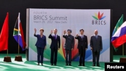 A Mar. 29, 2012 photo shows (L-R) Brazil's President Dilma Rousseff, Russian Pres. Dmitry Medvedev, Indian PM Manmohan Singh, former Chinese Pres. Hu Jintao and South African Pres. Jacob Zuma at the BRICS Summit in New Delhi, India.