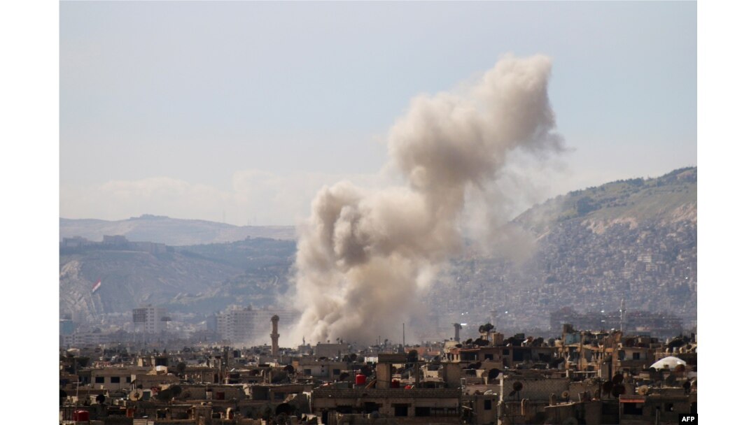 Smoke billows following a reported air strike in the rebel-held parts of the Jobar district, on the eastern outskirts of the Syrian capital Damascus, March 19, 2017.