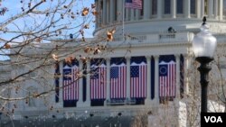 Flags are hung on the U.S. Capitol building in Washington, D.C., in preparation for Friday's inauguration of Donald Trump. 