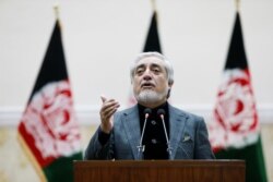 FILE - Afghanistan's presidential candidate Abdullah Abdullah speaks after the preliminary presidential election results in Kabul, Afghanistan, Dec. 22, 2019.
