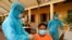 FILE PHOTO: Cambodian army members vaccinate people in Phnom Penh
