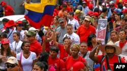 Supporters of Venezuelan President Hugo Chavez take part in a rally in Caracas to commemorate 24 years of the Patriotic Rebellion of 1989, Feb. 27, 2013,