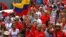Supporters of Venezuelan President Hugo Chavez take part in a rally in Caracas to commemorate 24 years of the Patriotic Rebellion of 1989, Feb. 27, 2013,